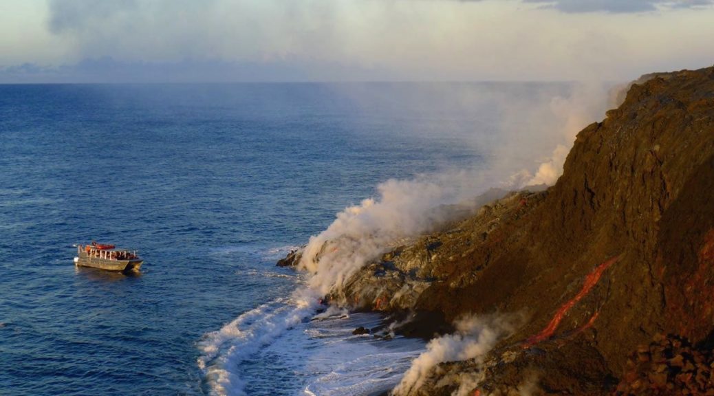 lava boat tour sees lava flowing into the ocean at the Big Island of Hawaii