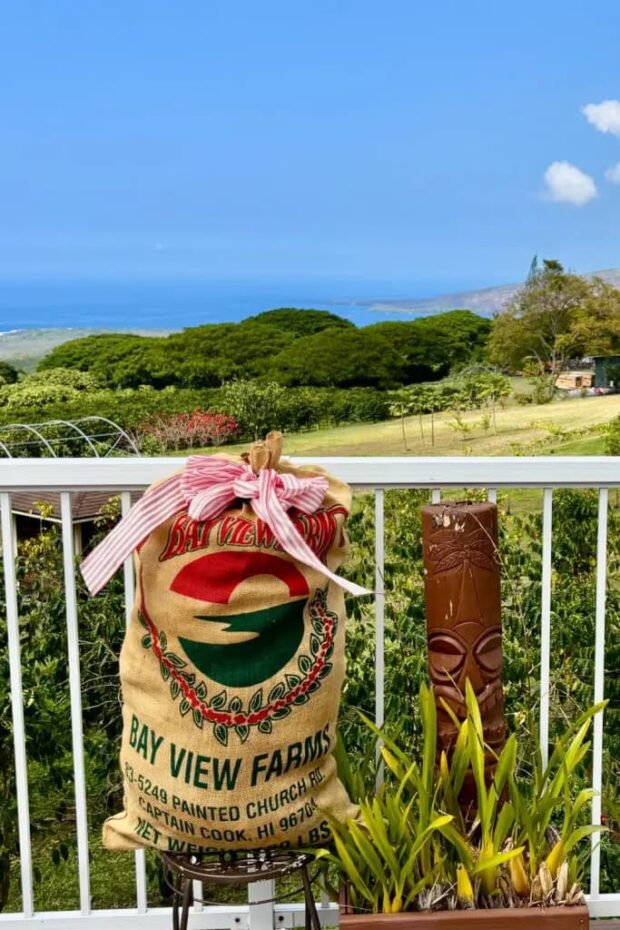 Sack of Kona coffee on the Bay View Coffee Farm porch above Kealakekua Bay