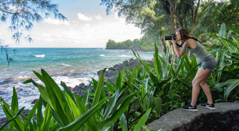 photographer taking a photo of the ocean