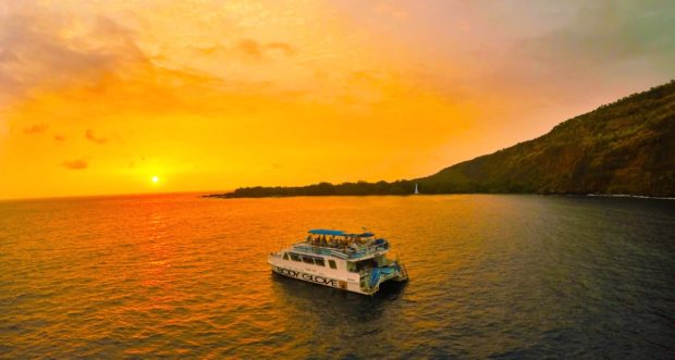 body glove catamaran moored at kealakekua bay for sunset