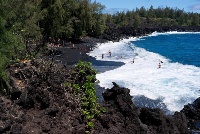 Kehena Beach is a narrow black sand beach located on the east shore of the island of Hawaii