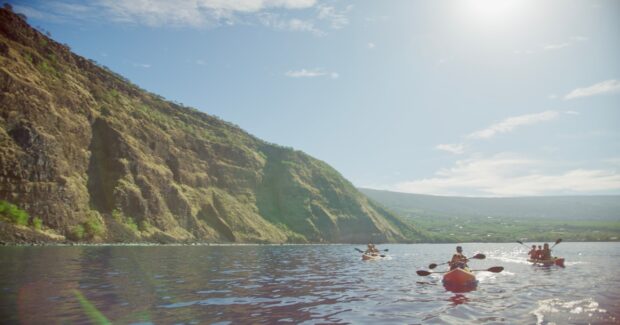 Kayakers arriving at Kaʻawaloa below the Captain Cook monument in Kealakekua Bay