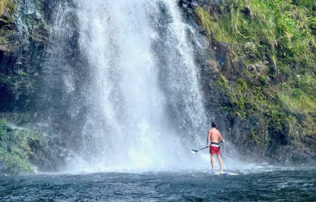 SUP under the Kulaniapia Fals in Hilo, Hawaiʻi
