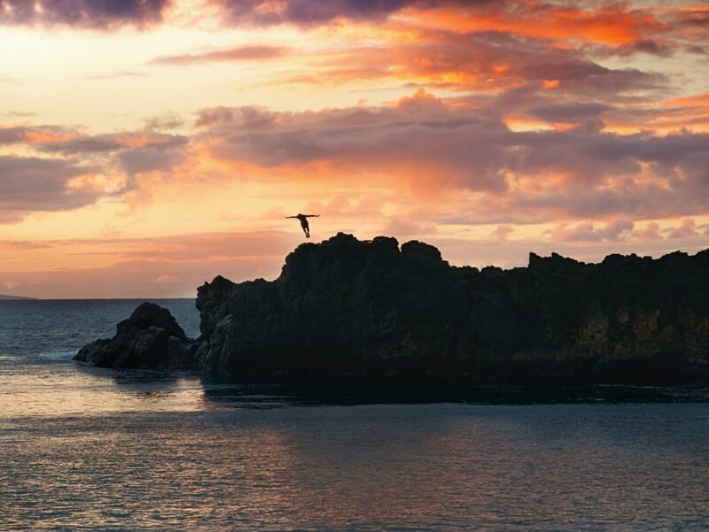 Sunset cliff dive at Black Rock on Maui