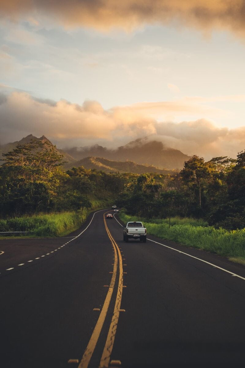 cars on the road during golden hour on Kauai