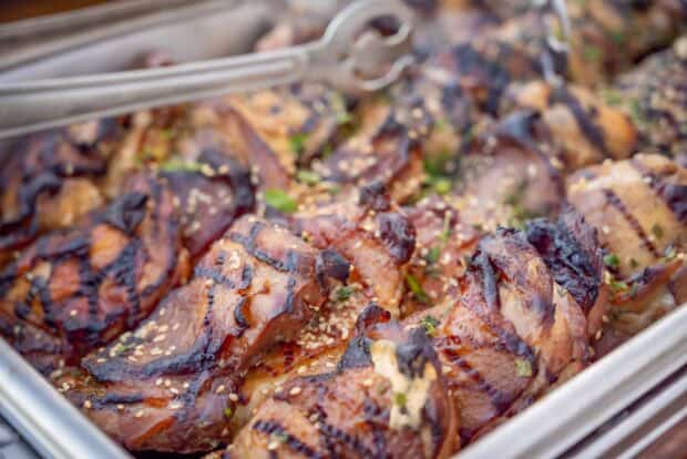 Grilled huli huli chicken with sesame seeds in a buffet tray at the Grand Hyatt Kauaʻi lūʻau