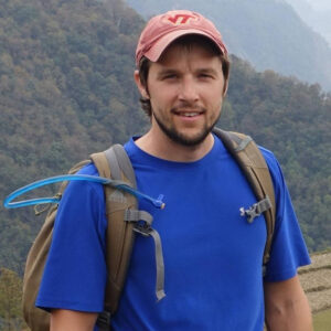 headshot of Will McGough, hiking on Oahu