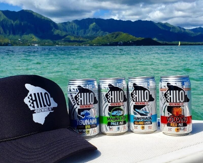 hilo brewing company beers with a hat and a tropical background