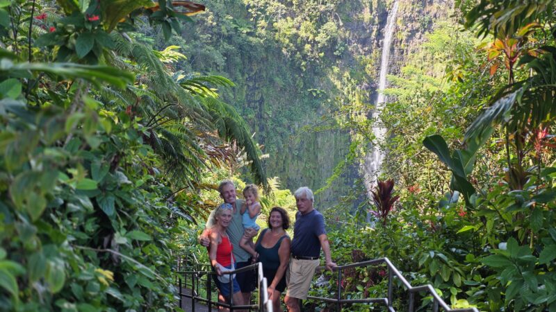 Gerrit van der Plas and Joey Gutierrez with their daughter and Gerrit's parents in front of ʻAkaka Falls, Hawaiʻi Island, October 2025