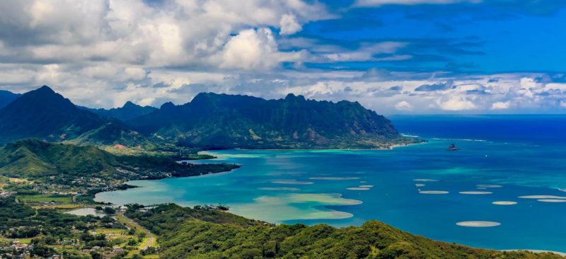 Kualoa Regional Park (center) and Chinaman's Hat Island (right) seen over Kaneohe Bay