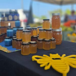 Jars of raw honey on a Bee Boys table at the Keauhou Farmers Market
