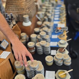 Display of Bee Boys balms, salves, and soaps at the Keauhou Farmers Market