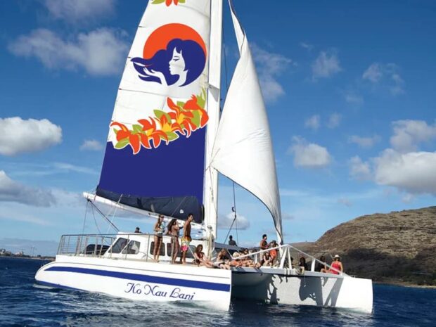 Catamaran with people in the water in the west Oʻahu ocean