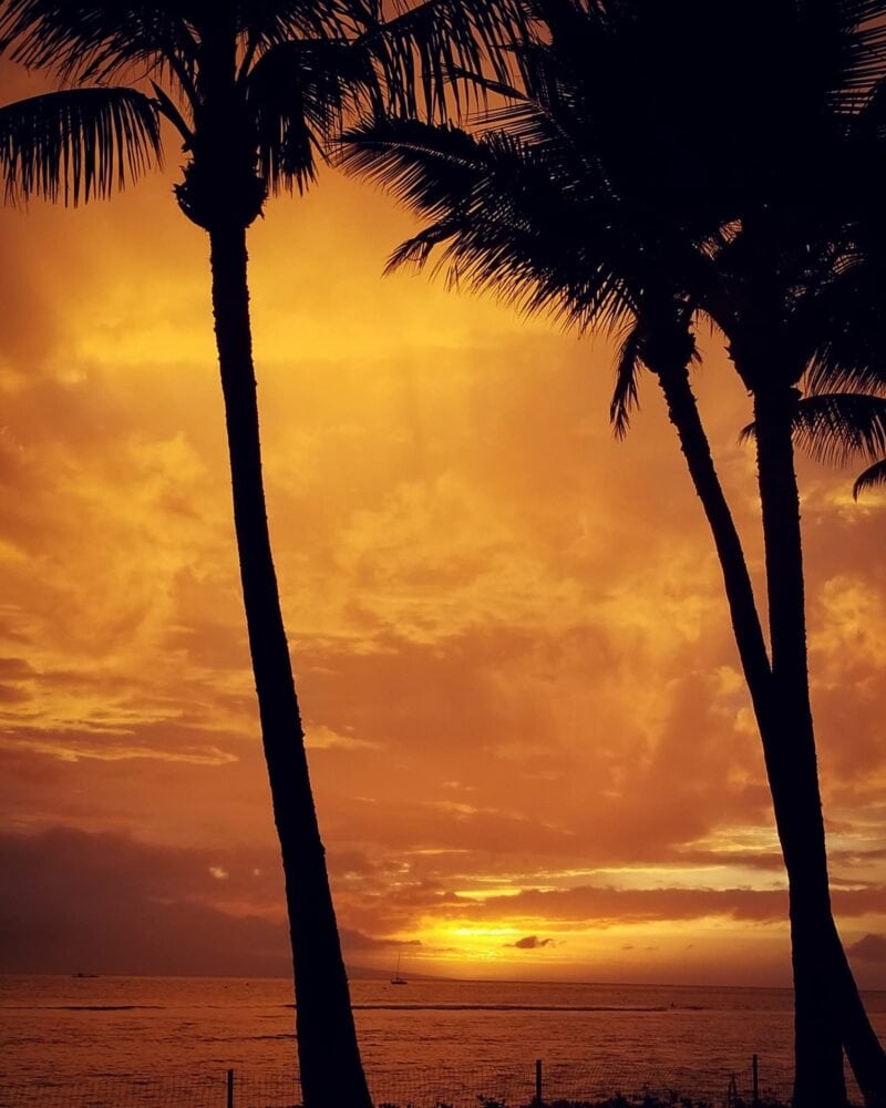 Sunset against a stormy sky from the Frontstreet waterfront in Lahaina, Maui