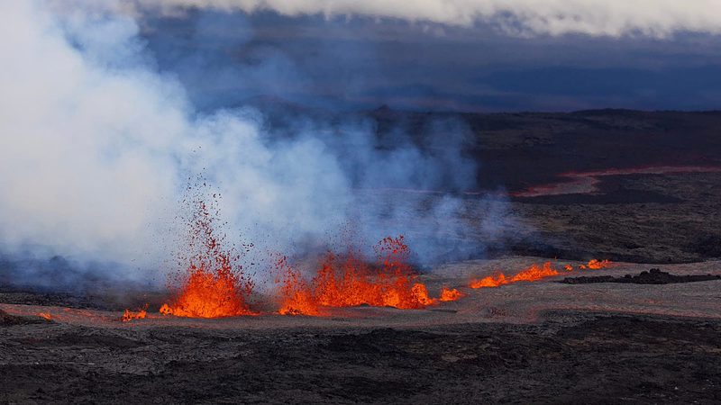 Lava fountaining out of fissures in the Mauna Loa summit crater. Image: Paradise Helicopters.