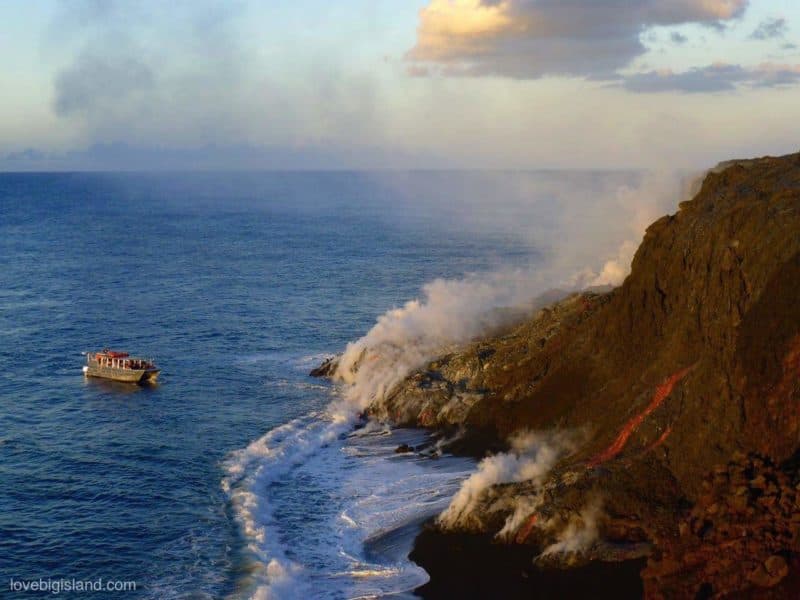 lava boat tour sees lava flowing into the ocean at the Big Island of Hawaii