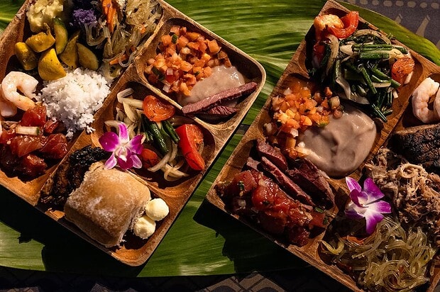 Hawaiian buffet spread at the Mauna Kea Luau including ahi poke and kalua pig, Big Island Hawaii