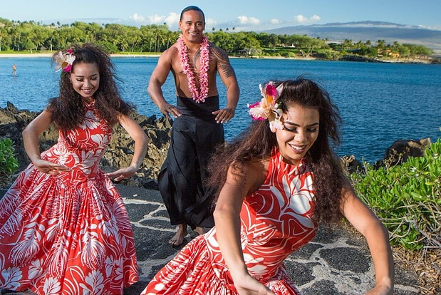 Hula dancers performing at the Mauna Kea Luau with Kauna'oa Bay in the background, Kohala Coast