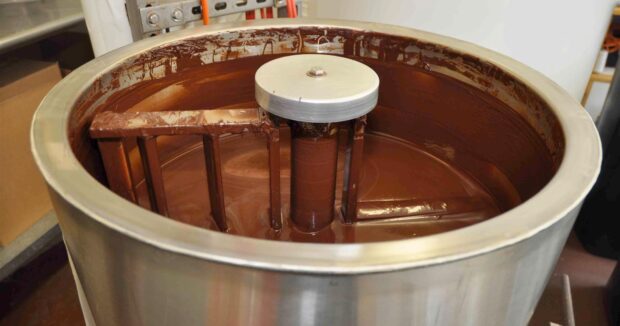 A chocolate-making machine processing cacao into chocolate at the Original Hawaiian Chocolate Factory, Keauhou, South Kona