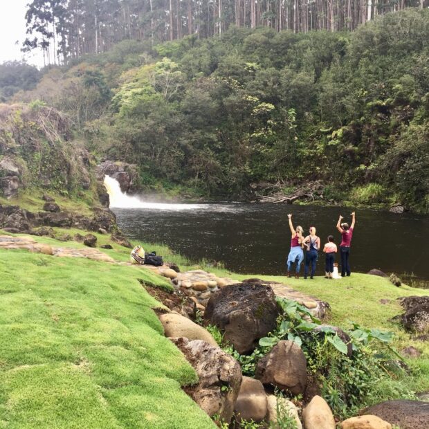 4 people at waterfall