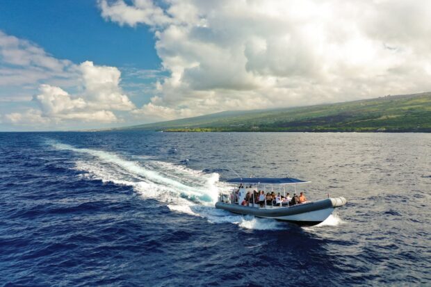 super raft speeding along the Kona coast