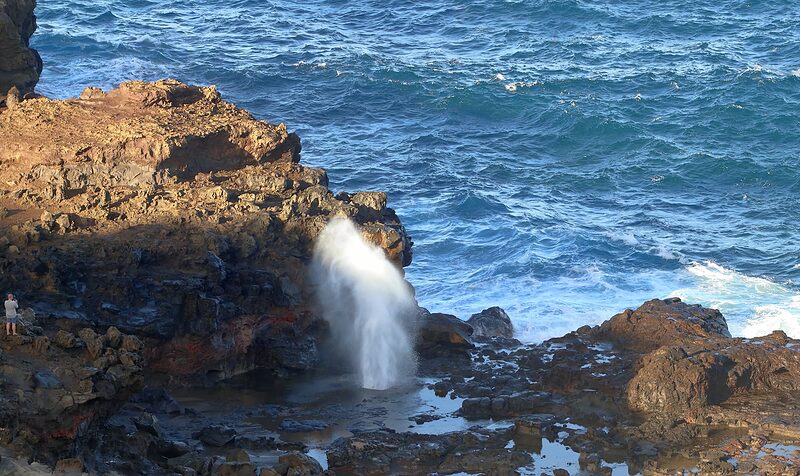 The Nakalele Blowhole on Maui. See the person in the left of the image for scale. Photo by Simon Hurry on Unsplash.