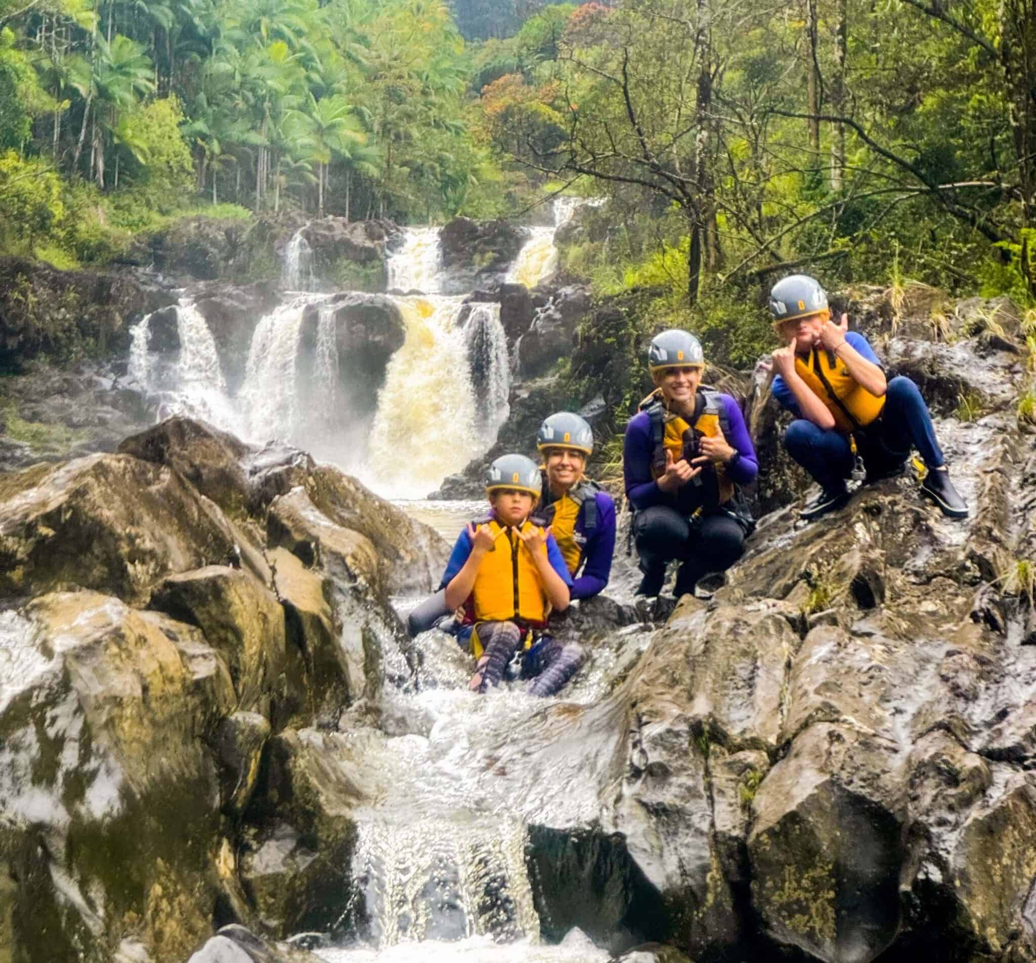 Rappel down the Triple-Tier Umauma Waterfall and swim the pools between