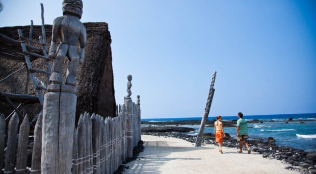 two people walking in the Pu’uhonua o Honaunau National Historical Park