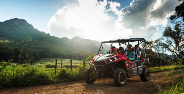 Group of four riders in a Kawasaki UTV on the Kipu Ranch tour on Kauaʻi